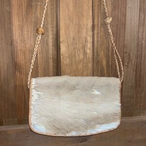 Vintage handmade cow hide purse